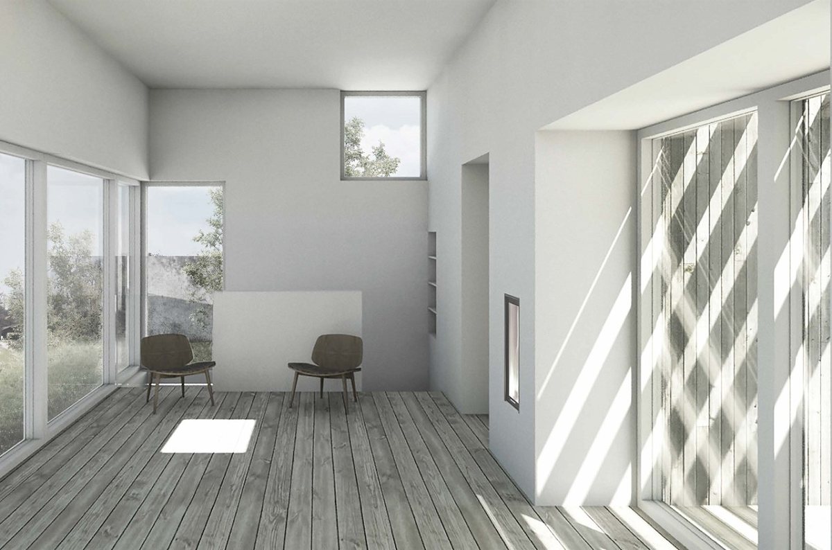 Moderne feriehus i træ i kystnært landskab